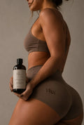 Woman holding Hello Honest Anti-Cellulite Oil for body care and sculpting | HSW